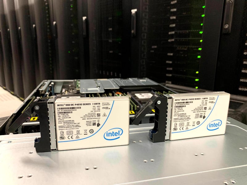 An SSD Nodes server with two Intel NVMe drives in front of it.